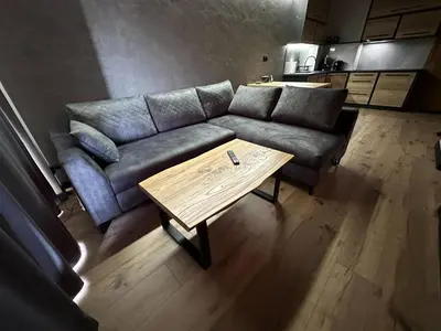 a living room with a couch and a coffee table at ApartLoft 64 Apartament Zator in Zator