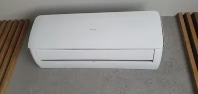 a white printer sitting on the floor in a room at ApartLoft 64 Apartament Zator in Zator