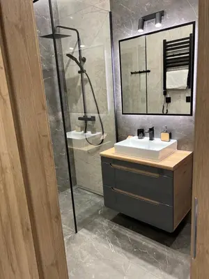 a bathroom with a sink and a shower at Apartament No 61 Blue Holiday Home Zator in Zator