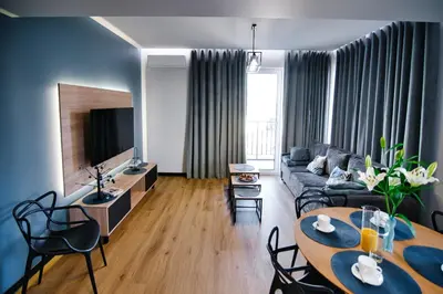 a living room with a couch and a table at Apartament No 61 Blue Holiday Home Zator in Zator