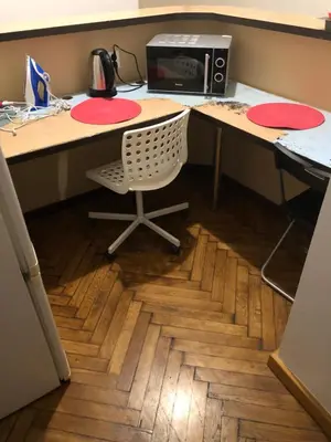 an office with a desk with a chair and a computer at Wawel in Kraków