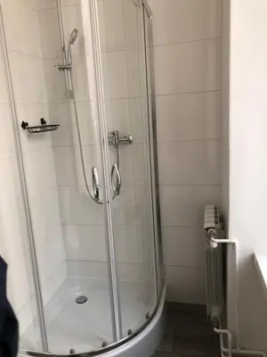 a shower with a glass door in a bathroom at Wawel in Kraków