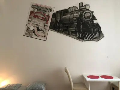 a drawing of a train hanging on a wall at Wawel in Kraków