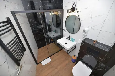 a bathroom with a shower and a toilet and a sink at REZYDENCJA ZATOR in Zator
