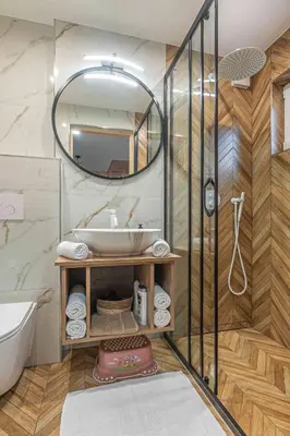 a bathroom with a sink and a mirror at Domek Komfort w górach przy Parku in Rabka