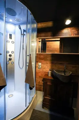 a bathroom with a sink and a shower at Górna Chata Mountains Chalet in Ochotnica Górna