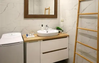 a bathroom with a sink and a mirror at Cozy Apartment In Zator With Wifi in Zator