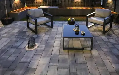 a patio with two chairs and a coffee table at Cozy Apartment In Zator With Wifi in Zator