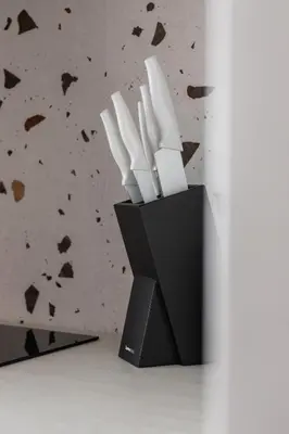 a black knife block with white knives in it at Casa Feliz Zabłocie Studio for 4 Guests Cracow by Noclegi Renters in Kraków