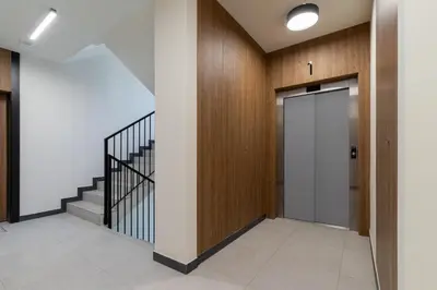 a hallway with a door and a staircase at Casa Feliz Zabłocie Studio for 4 Guests Cracow by Noclegi Renters in Kraków