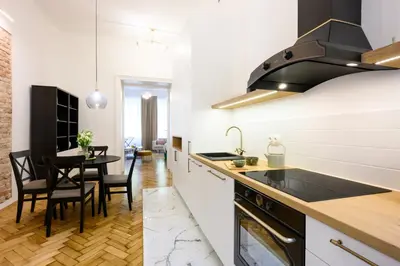 a living room with a couch and a tv at Native Apartments Dietla 71 in Kraków