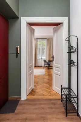 a hallway with a door open to a room at Przestronny Apartament w Centrum Krakowa - 12 osób - by Upstairs in Kraków