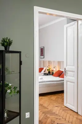 a door leading to a bedroom with a bed at Przestronny Apartament w Centrum Krakowa - 12 osób - by Upstairs in Kraków