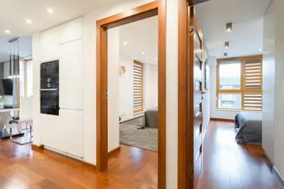 a living room with a door leading to a living room at Superior Apartment with Terrace & Free Parking in Kraków