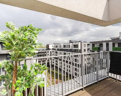 a balcony with a view of buildings at Superior Apartment with Terrace & Free Parking in Kraków