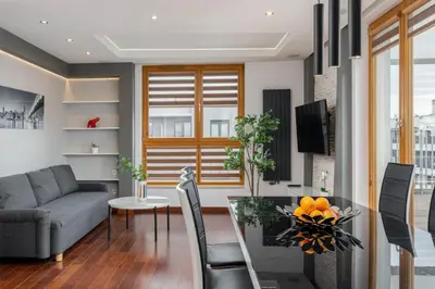 a living room with a couch and a table at Superior Apartment with Terrace & Free Parking in Kraków