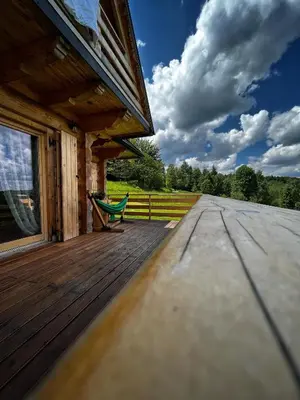 a living room with a couch and a table at Pacygówka in Skawica