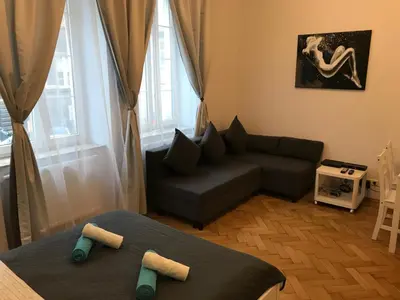 a small living room with a couch at Miodowa Kazimierz Apartment in Kraków