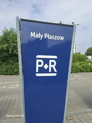 a blue sign for a playasy playroom on a street at Bagry Rooms3 LoveKrakow in Kraków