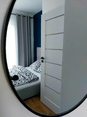 a bathroom with a vanity with a mirror and a sink at GOOD PLACE Zator in Zator